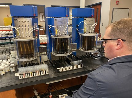 Technician running truck fluid samples in a lab