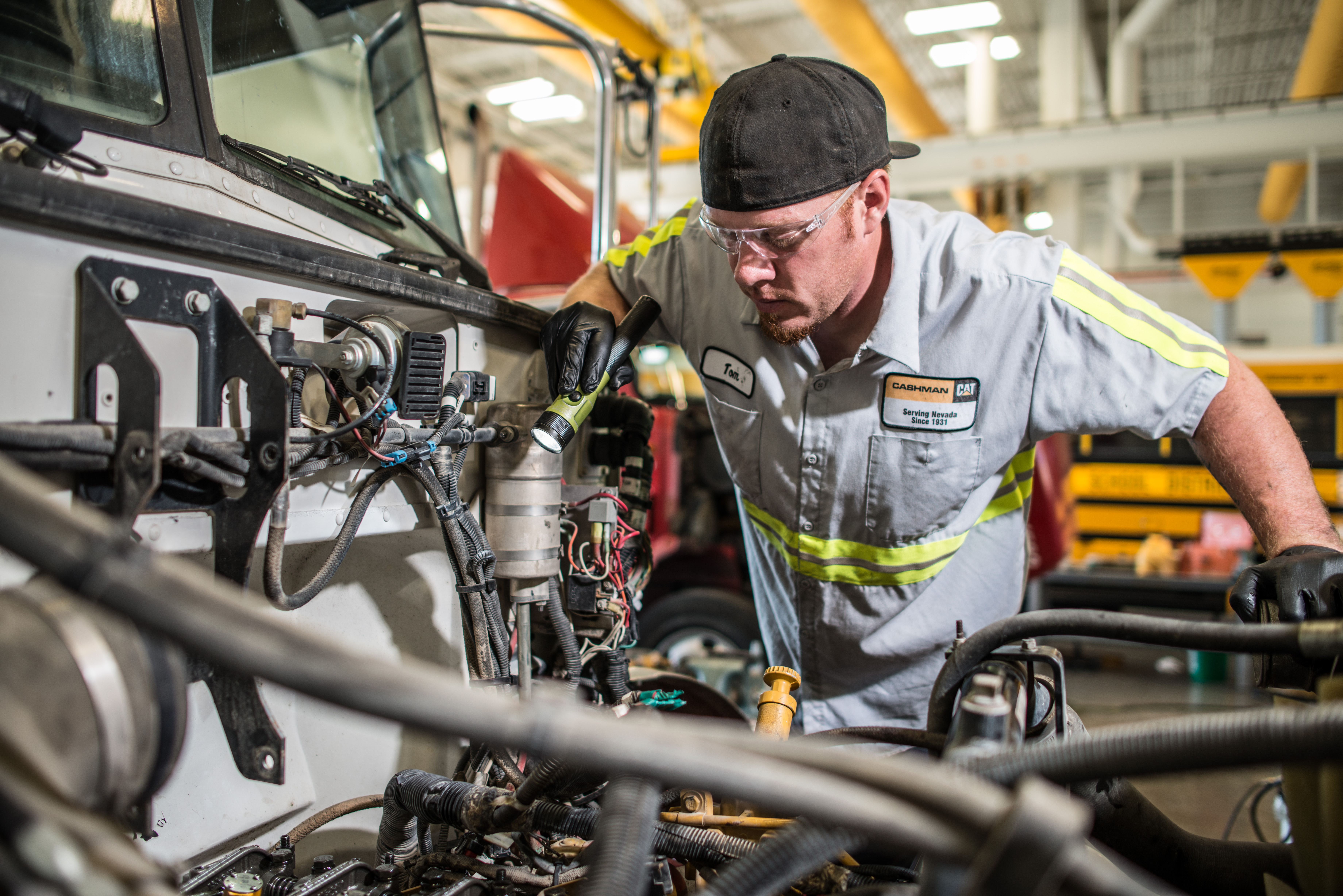 thompson truck tech looking at engine